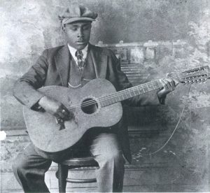 Blind Willie McTell photo with 12 string guitar